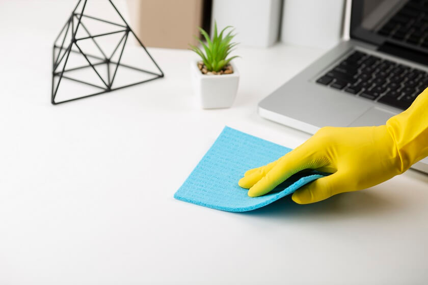 Hand in glove performing office cleaning in Long Island, NY
